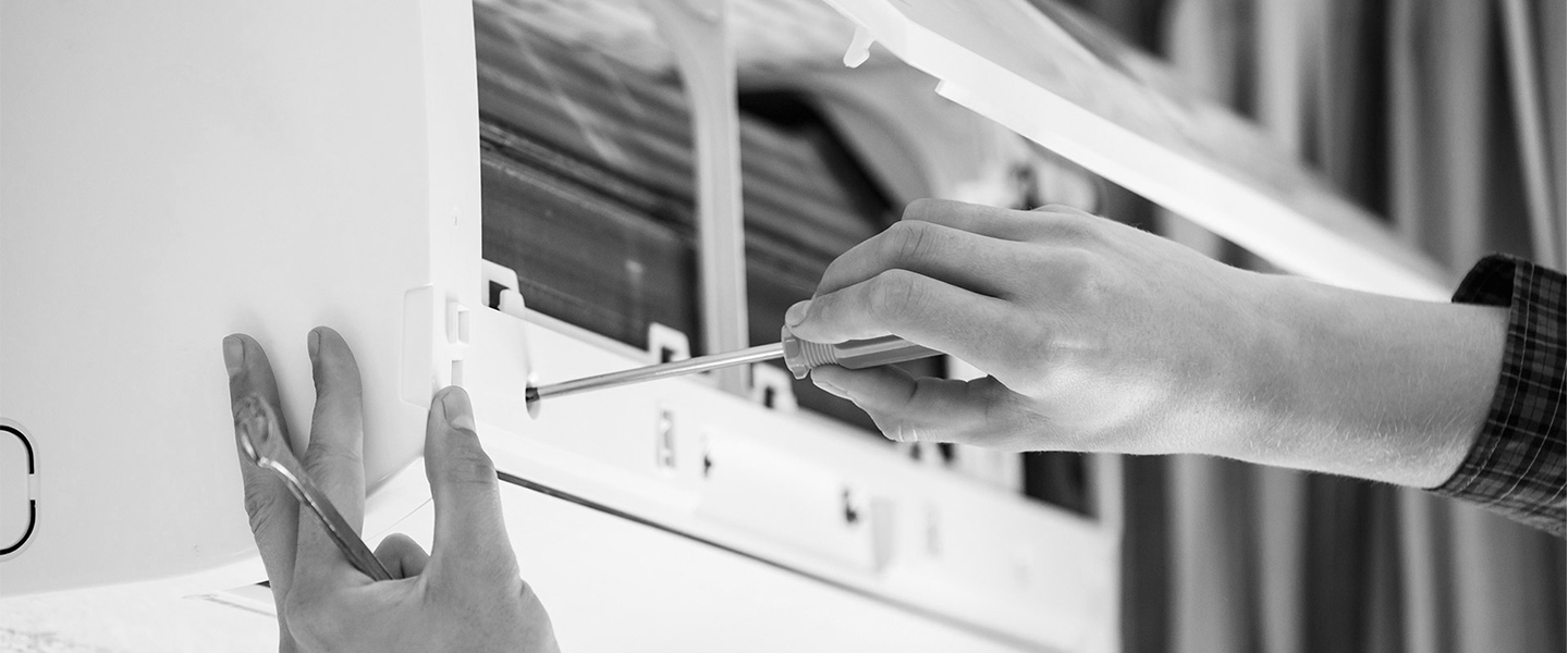 man-checking-air-conditioning-unit-wilmington-oh-blac